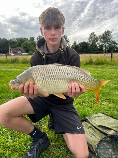 Mark Woodhouse with an impressive 9lb common - Sundorne Castle Fishery